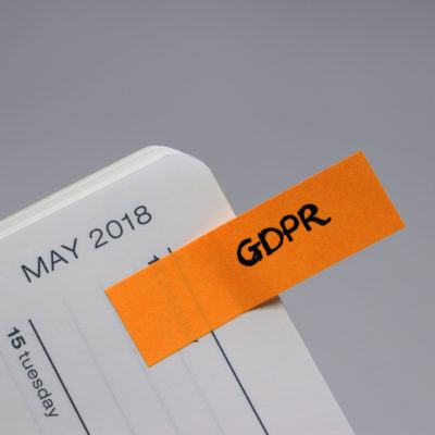 Image of a calendar for May 2018 with an orange paper and the letters "GDPR"